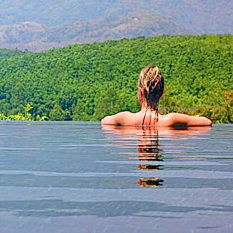 Woman in Infinity or negative edge pool