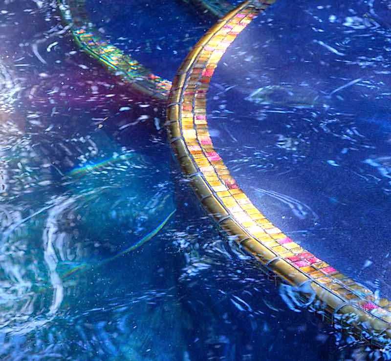 Kid with Broncos hat enjoying pool